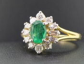 SUPER EMERALD AND DIAMOND 18 CARAT GOLD CLUSTER RING