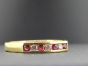 LOVELY RUBY AND DIAMOND HALF ETERNITY 18 CARAT GOLD RING