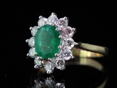 STUNNING COLOMBIAN EMERALD AND DIAMOND 18 CARAT GOLD CLUSTER RING