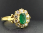 TANTALISING COLUMBIAN EMERALD AND DIAMOND 18 CARAT GOLD HALO CLUSTER