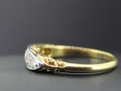 ROMANTICALLY CARVED EDWARDIAN FIVE STONE HALF HOOP RING