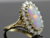 AN ORIGINAL EDWARDIAN OPAL AND DIAMOND 18CT GOLD RING