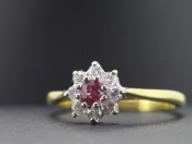 LOVELY RUBY AND DIAMOND 18 CARAT GOLD CLUSTER RING
