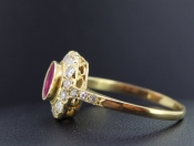 LUXURIOUS RUBY AND DIAMOND 18 CARAT GOLD HALO RING