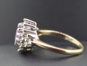 STUNNING OVAL PINK SAPPHIRE AND DIAMOND 9 CARAT GOLD CLUSTER RING