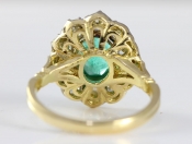  A MESMERISING EMERALD AND DIAMOND CLUSTER 18 CARAT GOLD RING