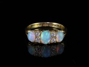 A STUNNING GENUINE EDWARDIAN AUSTRALIAN OPAL AND DIAMOND 15CT RING