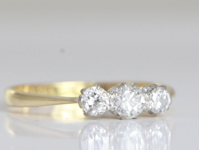 LOVELY DIAMOND TRILOGY 18 CARAT GOLD AND PLATINUM RING