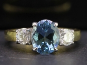 BREATHTAKING AQUAMARINE AND DIAMOND TRILOGY 18 CARAT GOLD RING