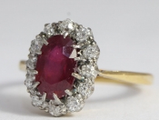  A DAZZLING RUBY AND DIAMOND 18 CARAT GOLD CLUSTER RING