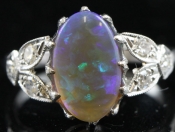 STUNNING BLACK OPAL AND DIAMOND 18 CARAT GOLD RING