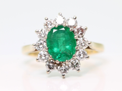 STUNNING COLOMBIAN EMERALD AND DIAMOND 18 CARAT GOLD CLUSTER RING