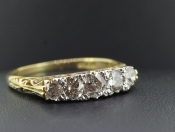 PRETTY EDWARDIAN FIVE STONE DIAMOND 18 CARAT GOLD RING