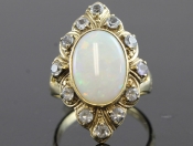 STYLISH REVIVAL INSPIRED TURN OF THE CENTURY 9 CARAT OPAL AND BLUE ZIRCON RING