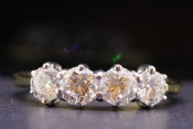 CAPTIVATING FOUR STONE DIAMOND 18 CARAT GOLD RING