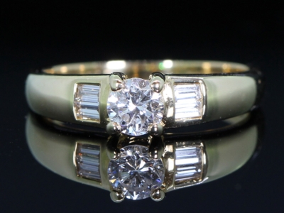 Diamond Solitaire with Baguette Diamond Shoulders 18ct Gold Ring