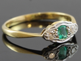 STYLISH EMERALD AND DIAMOND PLATINUM AND 18 CARAT GOLD RING 