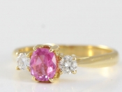 ENCHANTING PINK SAPPHIRE AND DIAMOND 18 CARAT GOLD TRILOGY RING