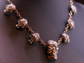 FABULOUS SEVEN SKULL AND DIAMOND SILVER SET 15 CARAT GOLD NECKLACE