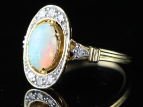 ENCHANTING OPAL AND DIAMOND 18 CARAT GOLD RING