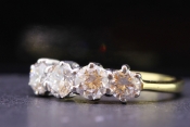 CAPTIVATING FOUR STONE DIAMOND 18 CARAT GOLD RING