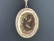 FABULOUS EDWARDIAN 9 CARAT GOLD BIRD FLORAL MOTIF OVAL LOCKET