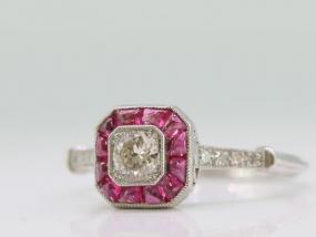 ART DECO INSPIRED DIAMOND AND RUBY PLATINUM TARGET RING