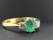 GORGEOUS EMERALD AND DIAMOND TRILOGY 18 CARAT GOLD RING