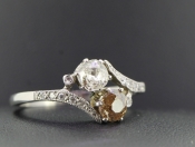  ELEGANT TWO STONE DIAMOND PLATINUM RING ON A TWIST