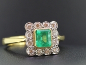 STUNNING EMERALD AND DIAMOND 18 CARAT GOLD CLUSTER RING