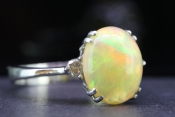  WONDERFUL OPAL AND DIAMOND THREE STONE 18 CARAT GOLD RING