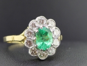 STUNNING EMERALD AND DIAMOND 18 CARAT GOLD CLUSTER RING