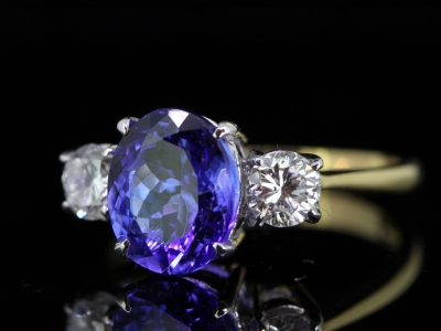 Stunning 3 Carat Tanzanite and Diamond  8 Carat  Gold Trilogy Ring