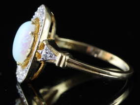 ENCHANTING OPAL AND DIAMOND 18 CARAT GOLD RING