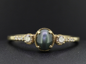 PRETTY ALEXANDRITE AND DIAMOND 9 CARAT GOLD RING