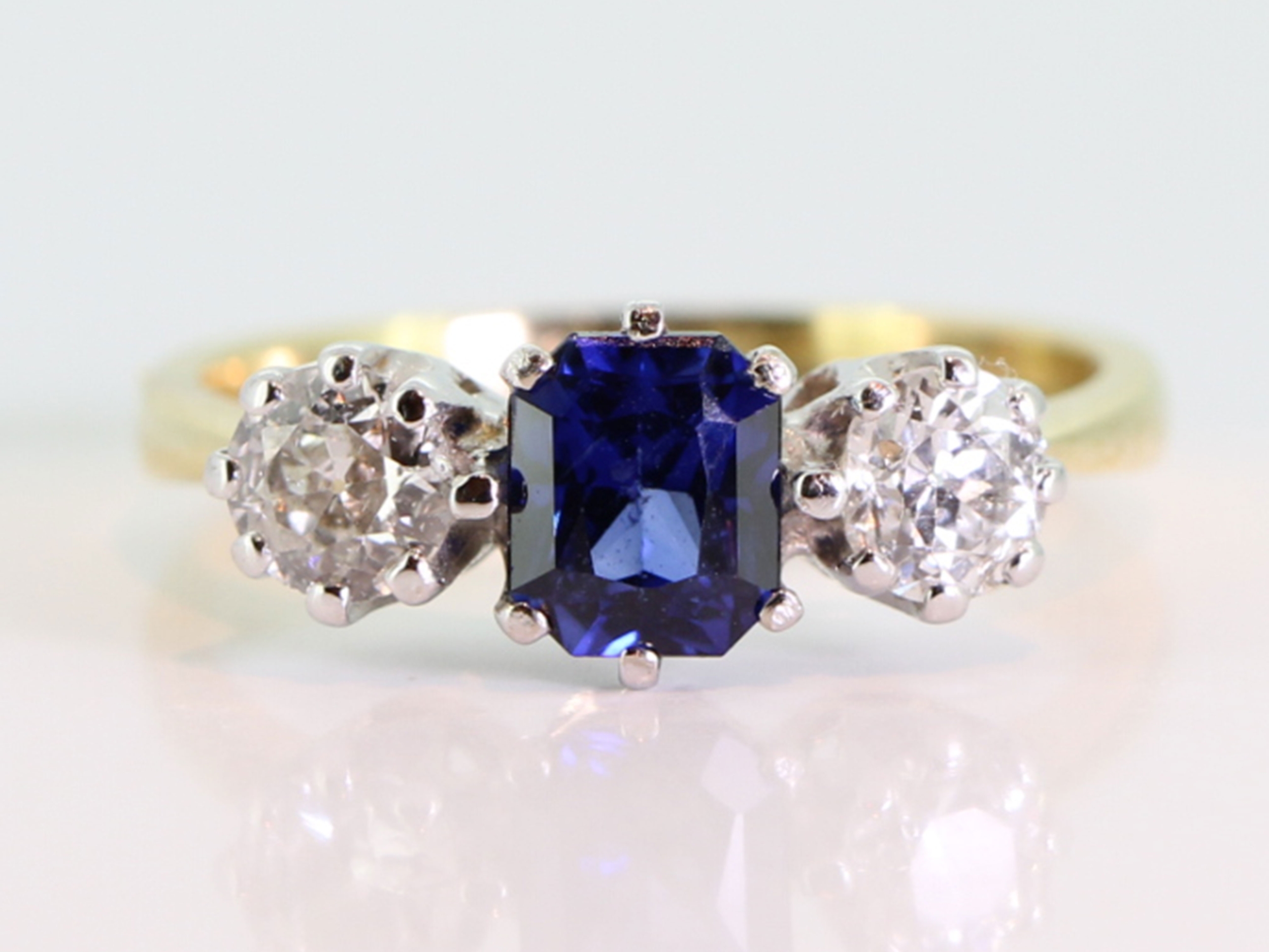 Ceylon sapphire and diamond 18 carat gold trilogy ring