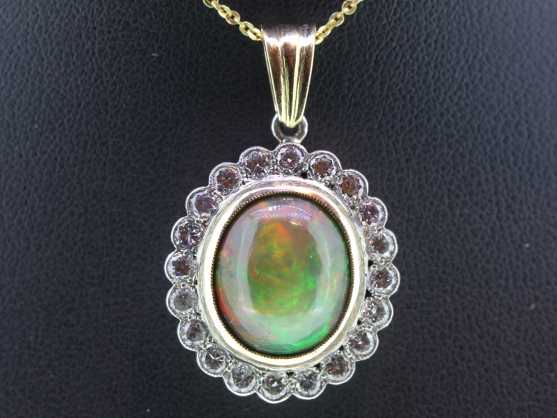 Stunning black opal and diamond gold and silver pendant