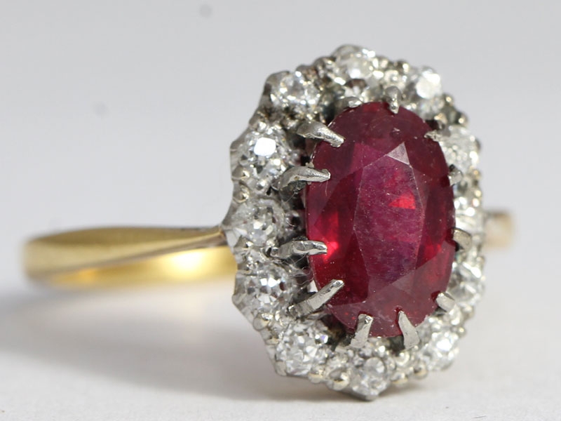  a dazzling ruby and diamond 18 carat gold cluster ring