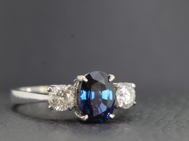 Elegant sapphire and diamond trilogy platinum ring