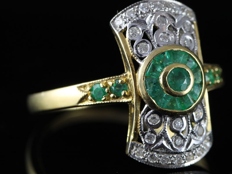  glamorous emerald and diamond cluster 18 carat gold ring