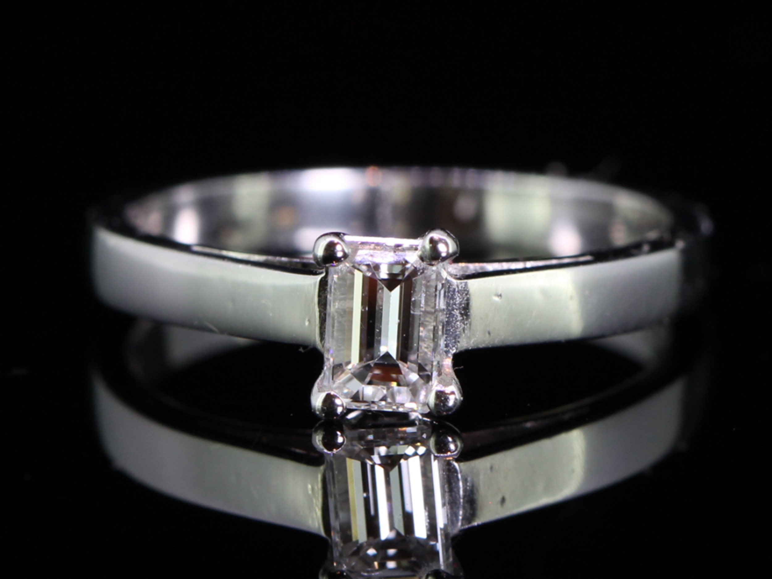 Breathtaking emerald cut diamond solitaire platinum ring