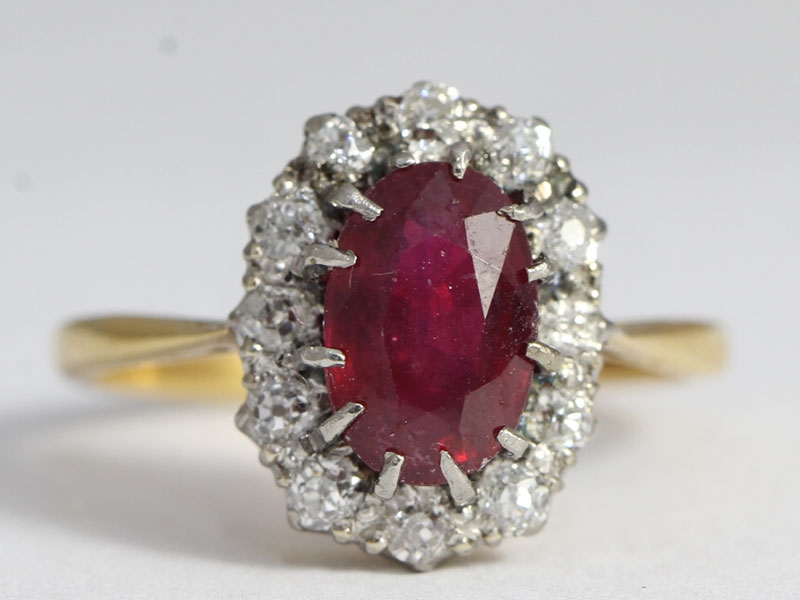  a dazzling ruby and diamond 18 carat gold cluster ring
