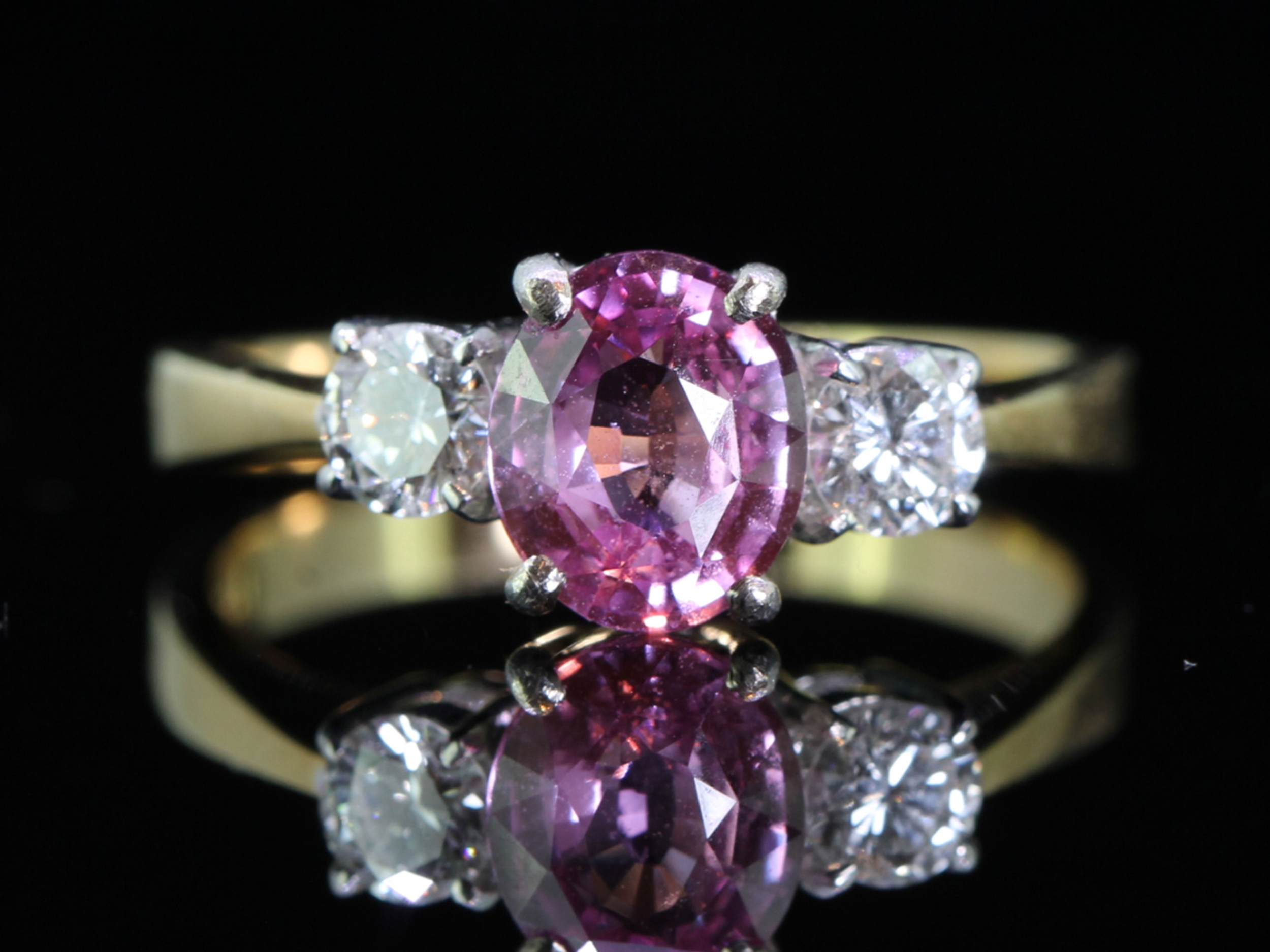 Beautiful pink sapphire and diamond 18 carat gold trilogy ring