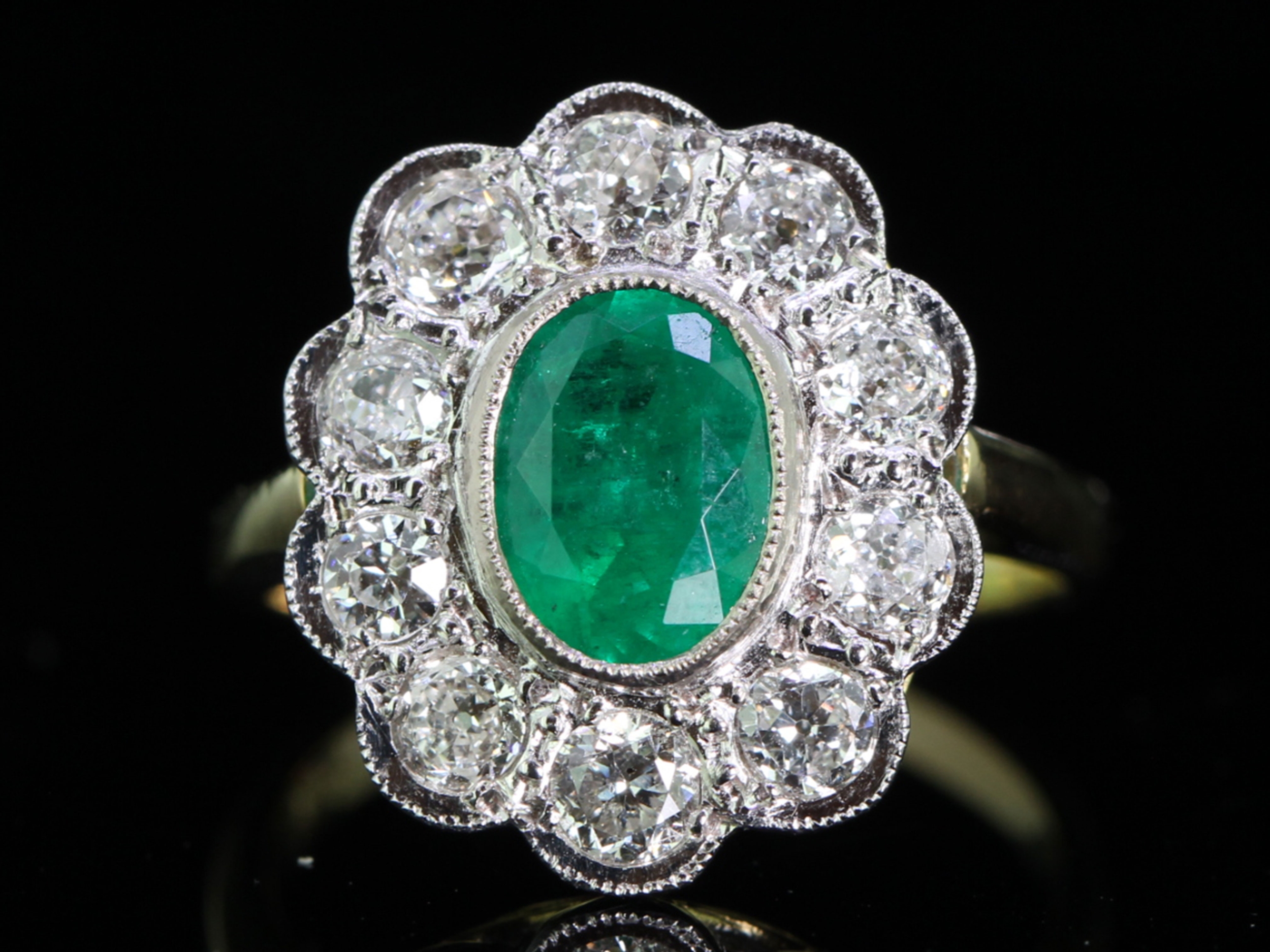 Ravishing colombian emerald and diamond 18 carat gold cluster ring