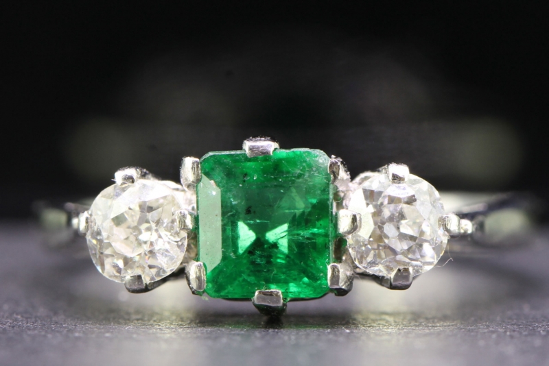 pretty emerald and diamond platinum gold trilogy ring