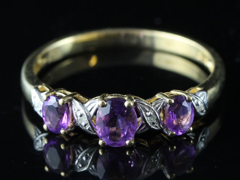  pretty amethyst and diamond three stone 9 carat gold ring