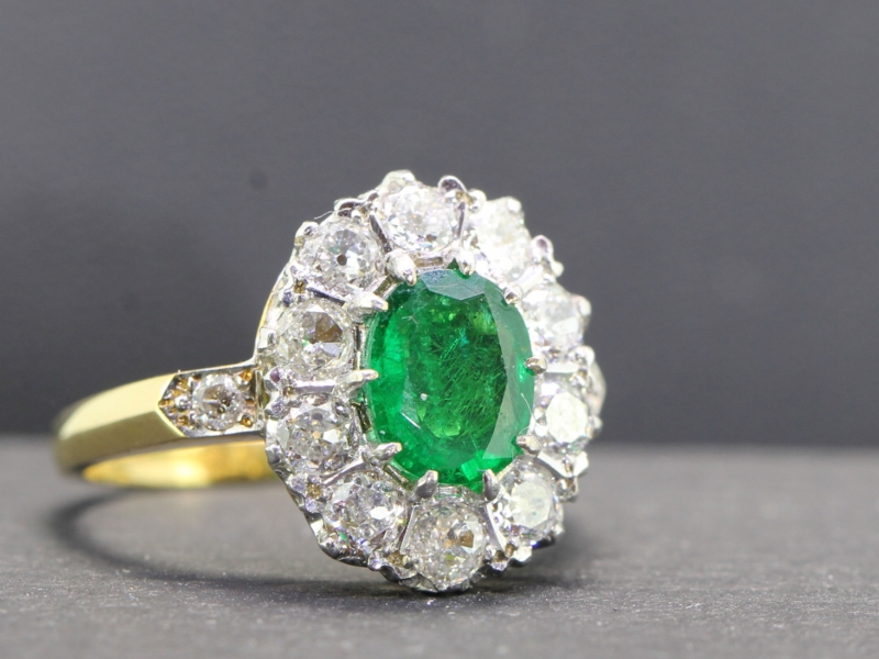 Sophisticated emerald and diamond 18 carat gold cluster ring