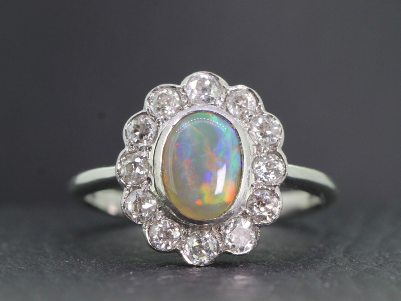 Spellbinding black opal and diamond platinum cluster ring