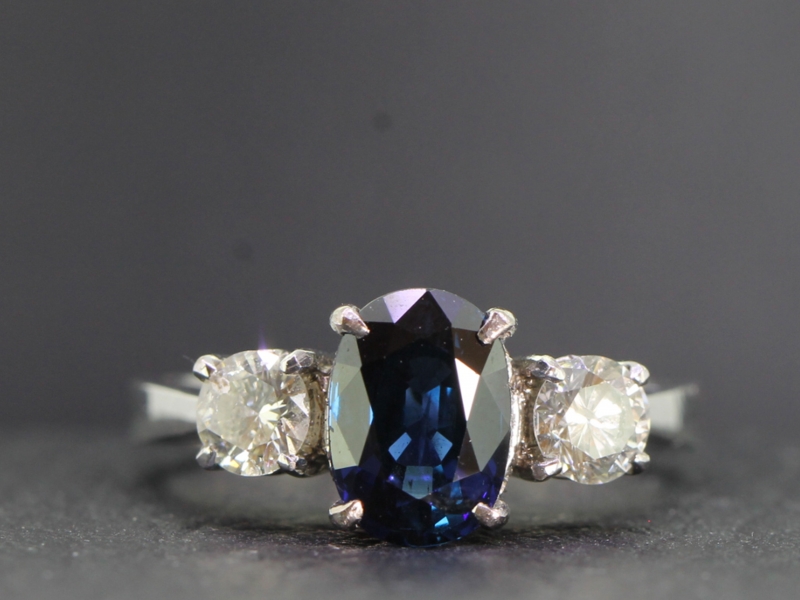 Elegant sapphire and diamond trilogy platinum ring