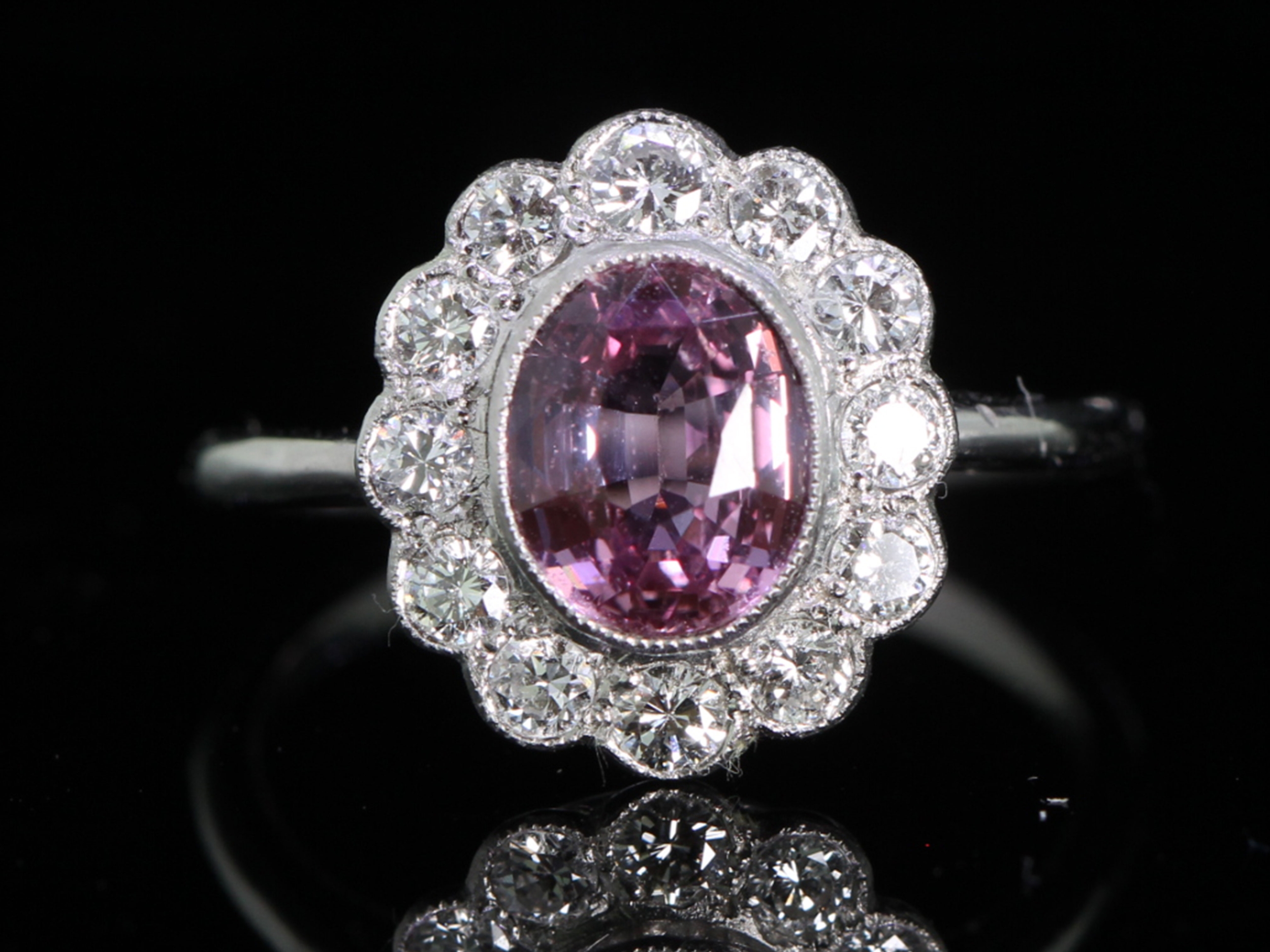 Gorgeous pink sapphire and diamond cluster platinum ring